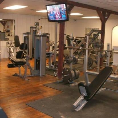 Collbran Fitness weight room with benches and strength machines
